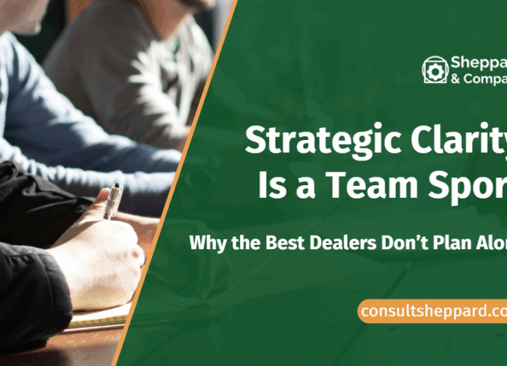 Image of a team at a desk. Strategic Clarity is a team sport.