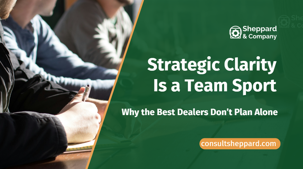 Image of a team at a desk. Strategic Clarity is a team sport.